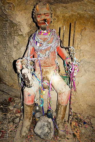 "el tio" in potosi silver mine (bolivia), altar, bolivia, cerro rico, cigarette, el el, icon, mina candelaria, mine tunnel, mining, offerings, potosí, red, serpentine throws, spirit, tio, tío el, underground mine