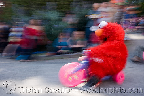 elmo racing at the byobw - "bring your own big wheel" race - toy tricycles (san francisco), big wheel, drift trikes, elmo costume, moving fast, potrero hill, race, red, sesame street costume, speed, speeding, toy tricycle, toy trike, trike-drifting