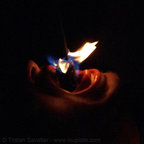 eric eating fire (san francisco), eating fire, fire dancer, fire dancing, fire eater, fire eating, fire performer, fire spinning, mouth, night, spinning fire