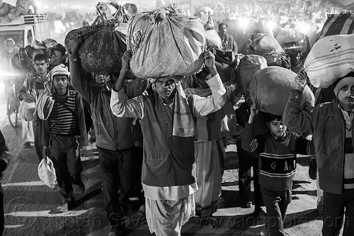 exodus - kumbh mela (india), bags, bundles, carrying on the head, crowd, exodus, hindu pilgrimage, hinduism, kumbh mela, luggage, men, night, walking, women