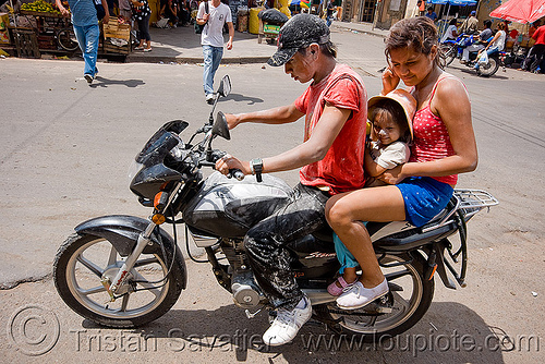 family on motorcycle - carnaval - carnival in jujuy capital (argentina), andean carnival, argentina, carnaval de la quebrada, family, jujuy capital, man, motorcycle, noroeste argentino, rider, riding, san salvador de jujuy, woman