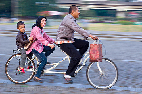 family riding tandem bicycle, boy, child, family, jakarta, kid, man, medan merdeka, merdeka square, moving, park, riding, road, tandem bicycle, tandem bike, woman