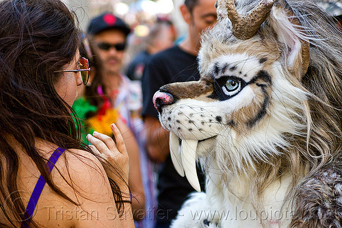 fantasy animal costume with big teeth, animal costume, blue eyes, cosplay, fantasy animal, fur, furry, gay pride festival, long teeth, saber tooth tiger, spottacus, woman