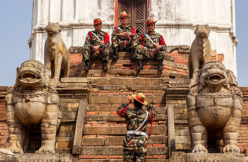 fasidega temple stone lions and gurkha army soldiers on temple steps - bhaktapur durbar square (nepal), bhaktapur, durbar square, fatigues, gorkhas, guards, gurkha army, gurkha regiment, gurkhas, hat, hindu temple, hinduism, men, military, nepalese army, red stripe, sculptures, soldiers, stairs, statue, steps, stone lions, uniform
