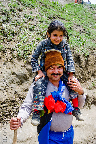 father with young daughter on his shoulder - pilgrim on trail - amarnath yatra (pilgrimage) - kashmir, amarnath yatra, child, daughter, father, hat, hindu pilgrimage, indian man, kashmir, kid, little girl, mountain trail, mountains, pilgrims