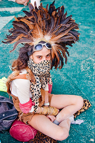 feather hat, attire, bracelets, burning man outfit, costume, feather headdress, feather headwear, feathers, goggles, leopard, panther, woman