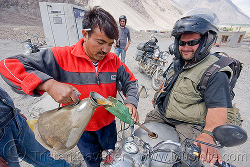 filling-up at the diskit petrol station - nubra valley - ladakh (india), ben, diskit, filling-up, fuel, gas pump, gas station, gasoline, ladakh, motorcycle touring, nubra valley, petrol pump, petrol station, pouring, road, royal enfield bullet