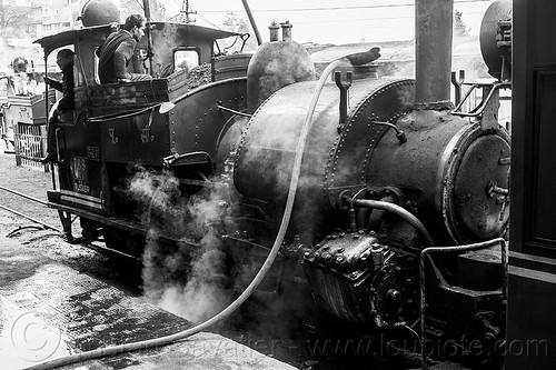 filling-up steam locomotive with water - darjeeling train station (india), 788 tusker, darjeeling himalayan railway, darjeeling toy train, filling-up, hose, men, narrow gauge, operators, railroad, smoke, smoking, steam engine, steam locomotive, steam train engine, train station, workers