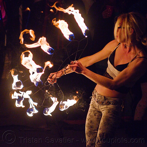 fire dancer with fire fans, american steel studios, cressie mae, fire dancer, fire dancing, fire fans, fire performer, fire spinning, holidays in flux, night, poplar gallery, spinning fire, woman