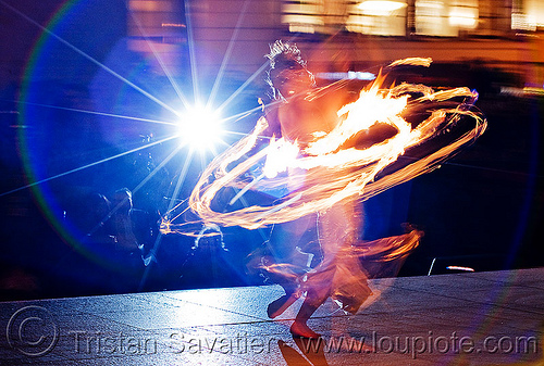 fire hula hoop - performer - temple of poi 2010 fire dancing expo (san francisco), fire dancer, fire dancing expo, fire hulahoop, fire performer, fire spinning, flash, lens flare, temple of poi, union square, woman