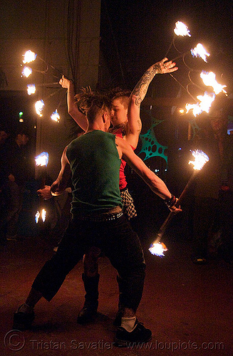 fire of love - leah and ro spinning fire (san francisco) - fire dancer, double staff, fire dancer, fire dancing, fire fans, fire performer, fire spinning, fire staffs, fire staves, leah, man, night, spinning fire, tattooed, tattoos, woman