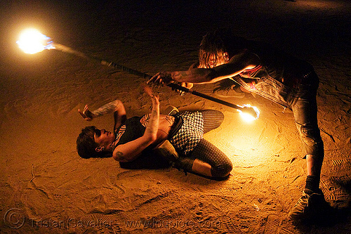 the fire of love - leah and ro with fire staff (san francisco) - fire dancer, bending backward, fire dancer, fire dancing, fire performer, fire spinning, fire staffs, fire staves, leah, love, man, night, spinning fire, tattooed, tattoos, woman
