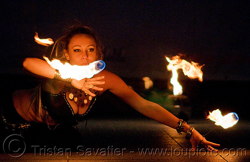fire performer forka from the group manda lights - temple of poi 2009 fire dancing expo - union square (san francisco), fire dancer, fire dancing expo, fire performer, fire spinning, forka, manda lights, night, spinning fire, surya, sûrya, temple of poi, woman