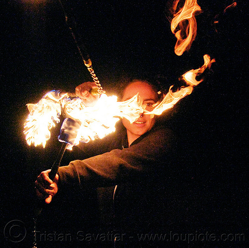fire performer spinning fire nunchaku, fire dancer, fire dancing, fire nunchaku, fire performer, fire spinning, night, nose piercing, sarah, septum piercing, woman