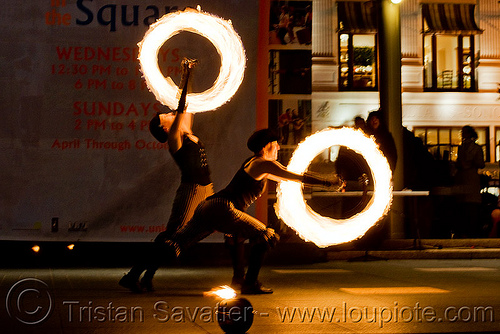 fire performers spinning poi - temple of poi 2009 fire dancing expo - union square (san francisco), circle, fire dancer, fire dancing expo, fire performer, fire poi, fire spinning, night, ring, spinning fire, temple of poi, woman