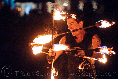 fire staves - performer - temple of poi 2010 fire dancing expo (san francisco), fire dancer, fire dancing expo, fire performer, fire spinning, fire staffs, fire staves, man, night, temple of poi, union square