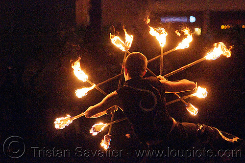 fire staves - performer - temple of poi 2010 fire dancing expo (san francisco), fire dancer, fire dancing expo, fire performer, fire spinning, fire staffs, fire staves, night, temple of poi, union square