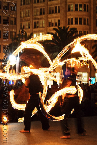 fire staves - performer - temple of poi 2010 fire dancing expo (san francisco), fire dancer, fire dancing expo, fire performer, fire spinning, fire staffs, fire staves, night, temple of poi, union square