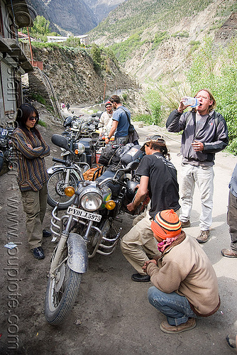 fixing the bikes - motorcycle mechanic shop - keylong - manali to leh road (india), christoph, grace liew, mechanic, motorcycle touring, road, royal enfield bullet, woman