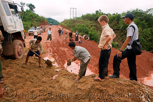 fixing the road with shovels (laos), lorry, men, mud, road, ruts, shoveling, shovels, truck
