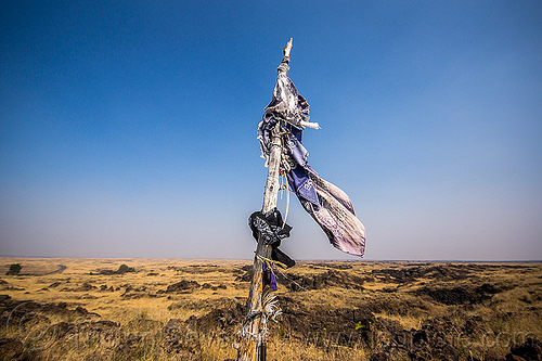 flags and native american offerings on memorial stick - captain jack's stronghold, basalt, captain jack's stronghold, cloth, flags, indigenous, landscape, lava beds national monument, memorial, modoc, native american, offerings, pole, stick, tribal, wooden