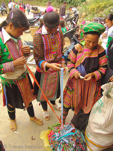 flower hmong women buying embroidered ribbons, asian woman, asian women, colorful, embroidered ribbons, flower h'mong tribe, flower hmong, girls, hill tribes, indigenous, rubans, street seller