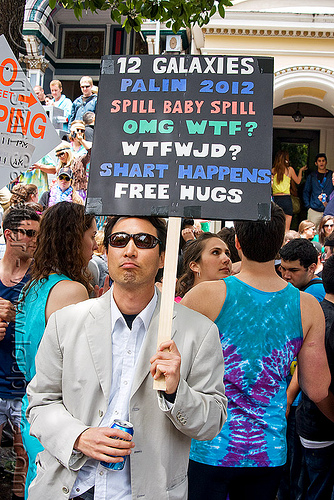 frank chu impersonator, 12 galaxies, bay to breakers, costume, crowd, footrace, frank chu impersonator, man, picket sign, protester, protesting, street party, sunglasses