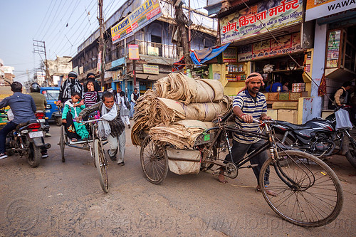 freight tricycle and cycle rickshaw (india), bags, cargo tricycle, cargo trike, cycle rickshaw, freight tricycle, freight trike, heavy, load bearer, man, motorcycles, moving, passengers, sacks, shops, traffic, transport, transportation, transporting, varanasi, walking, wallah