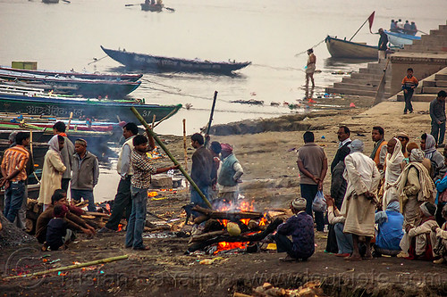 funeral pyre - cremation of a dead at harishchandra burning ghat - varanasi (india), burning ghat, corpse, cremation ghats, dead, fire, funeral pyre, ganga, ganges river, harishchandra ghat, hindu, hinduism, human cadaver, human remains, river boats, smoke, smoking, varanasi