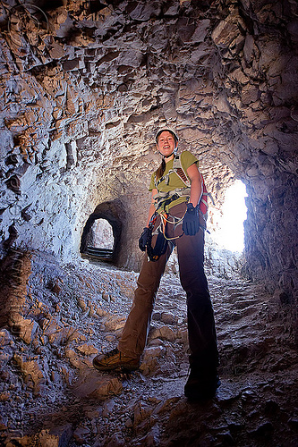 galeria paterno war tunnel - monte paterno via ferrata, alps, climber, climbing harness, climbing helmet, dolomites, galeria paterno, military tunnel, monte paterno, mountain climbing, mountaineer, mountaineering, mountains, parco naturale dolomiti di sesto, rock climbing, via ferrata, war tunnel, woman