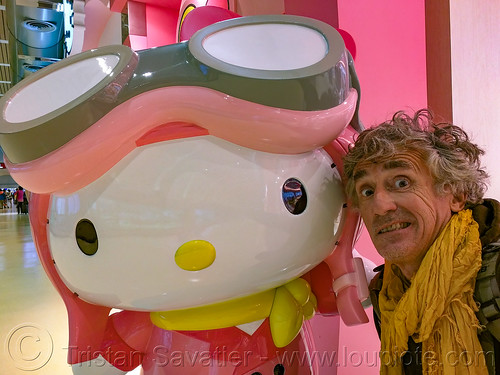 giant hello kitty sculpture - taoyuan airport lobby, airport lobby, art installation, hello kitty, man, selfie, statue, taiwan, taoyuan airport