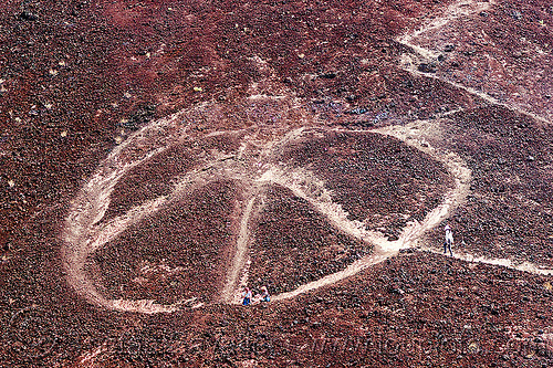 giant peace symbol on mountain, basalt, death valley, peace symbol, saline valley, stone graffiti, volcanic