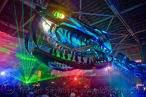 giant snake skeleton animated sculpture - opulent temple massive rave party (treasure island, san francisco) - serpent mother, art installation, fangs, green laser, head, laser lightshow, laser show, lasers, night, nightclub, opulent temple, sculpture, serpent mother, skeleton, snake, teeth