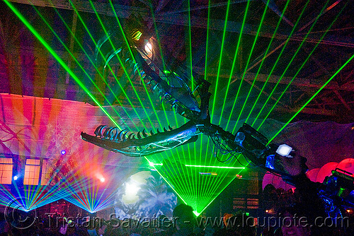 giant snake skeleton animated sculpture - opulent temple massive rave party (treasure island, san francisco) - serpent mother, art installation, fangs, green laser, head, laser lightshow, laser show, lasers, night, nightclub, opulent temple, sculpture, serpent mother, skeleton, snake, teeth