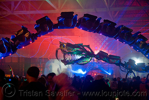 giant snake skeleton animated sculpture - opulent temple massive rave party (treasure island, san francisco) - serpent mother, art installation, green laser, laser lightshow, laser show, lasers, night, nightclub, opulent temple, sculpture, serpent mother, skeleton, snake