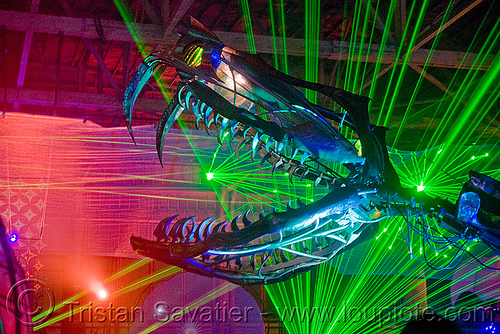 giant snake skeleton animated sculpture - opulent temple massive rave party (treasure island, san francisco) - serpent mother, art installation, fangs, green laser, head, laser lightshow, laser show, lasers, night, nightclub, opulent temple, sculpture, serpent mother, skeleton, snake, teeth