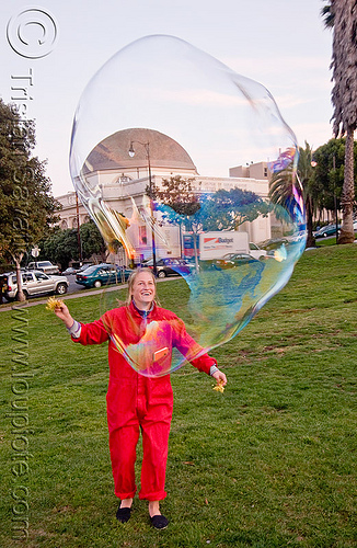 giant soap bubble, big bubble, giant bubble, iridescent, lawn, park, playing, red, soap bubbles, woman