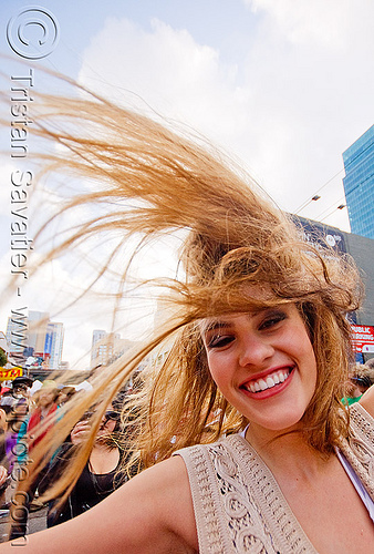 girl doing hair flip - how weird street faire (san francisco), hair flip, hait, long hair, windy, woman
