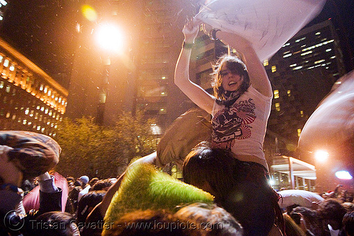 girl on a man's shoulders at the great san francisco pillow fight 2008, down feathers, night, pillows, world pillow fight day