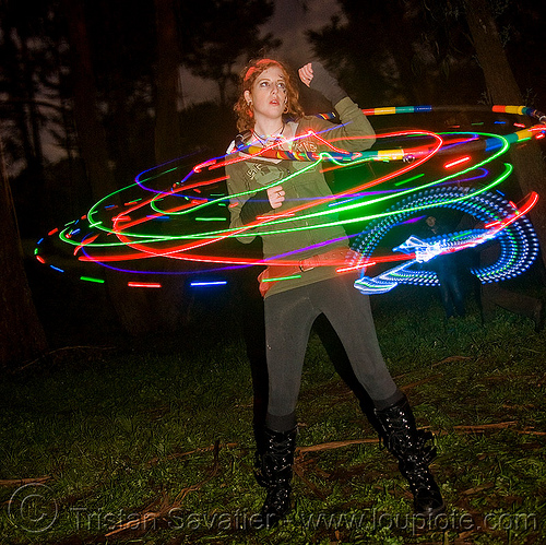 girl spinning a hula hoop with photon led lights, full moon party, glowing, golden gate park, hooper, hula hoop, hula hooping, led hoop, led lights, light hoop, microlights, night, rave lights, woman