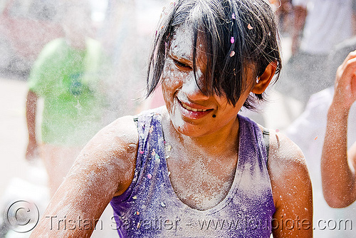 girl with confetti and white talk powder, andean carnival, argentina, carnaval de la quebrada, confettis, jujuy capital, noroeste argentino, san salvador de jujuy, serpentine throws, talk powder, white, woman