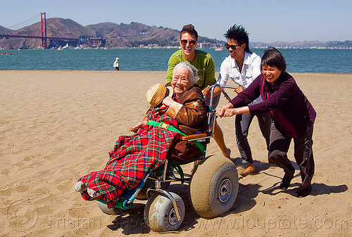 grandma on beach wheelchair at the beach, beach wheelchair, blanket, caretaker, chinese woman, crissy field beach, family, grandma, grandmother, jenn, old woman, rolling, sand, senior, straw hat, women