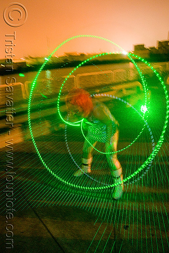 green laser hulahoop - superhero street fair (san francisco), green laser, islais creek promenade, laser hoop, laser hula hoop, night, superhero street fair, woman