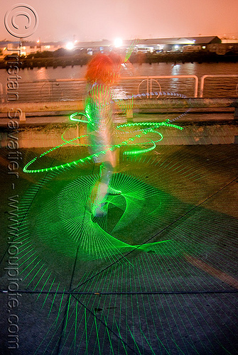 green laser hulahoop - superhero street fair (san francisco), green laser, islais creek promenade, laser hoop, laser hula hoop, night, superhero street fair, woman