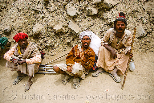 group of hindu pilgrims resting on the trail - amarnath yatra (pilgrimage) - kashmir, amarnath yatra, beard, cane, crutches, hindu pilgrimage, hinduism, kashmir, man, mountain trail, mountains, old men, pilgrims, resting, sadhus, sitting, walking stick