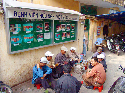 gruesome photos on hospital wall - vietnam, accidents, body parts, dismembered, emergency room, er, flesh, hanoi, hospital, maimed, medics, men, severe injuries, severed fingers, severed limbs, sign, surgery, torn, trauma