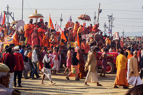 guru float pulled by tractor arrives at the sangam - kumbh mela (india), bhagwa, crowd, float, gurus, hindu pilgrimage, hinduism, kumbh maha snan, kumbh mela, mauni amavasya, parade, saffron color, umbrellas, walking