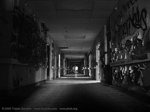 hallway with peeling paint in abandoned hospital, abandoned building, abandoned hospital, creepy, eerie, graffiti, peeling paint, presidio hospital, presidio landmark apartments, spooky, trespassing, vanishing point