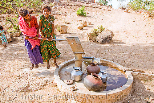 hand pump - country girls pumping water, children, clay pots, hand pump, india, kids, little girl, udaipur, water jars, water jugs, water pump