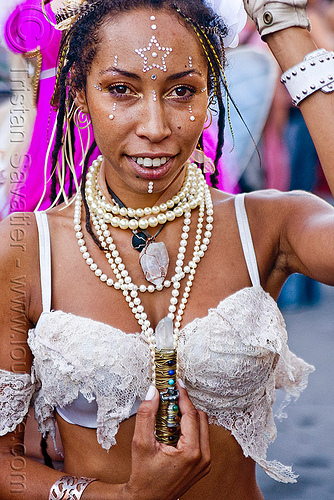 healer with quartz crystal, bindis, kalikia, necklaces, quartz crystal, woman